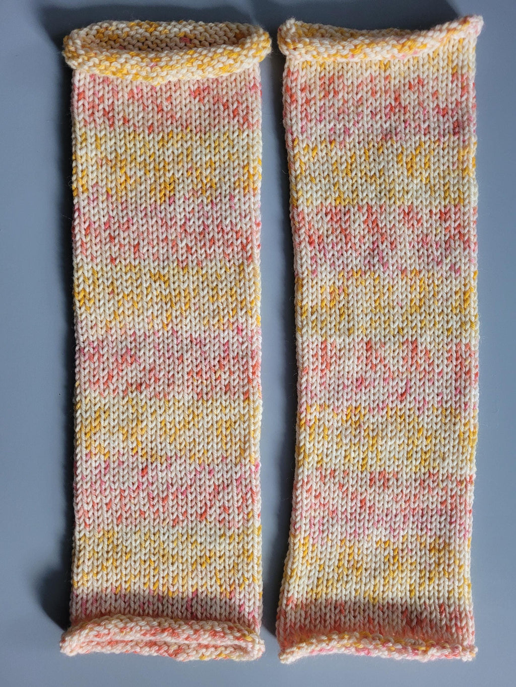 leg warmers,  woolen,  warm and breathable,  in warm colours, yellow, cream and pink